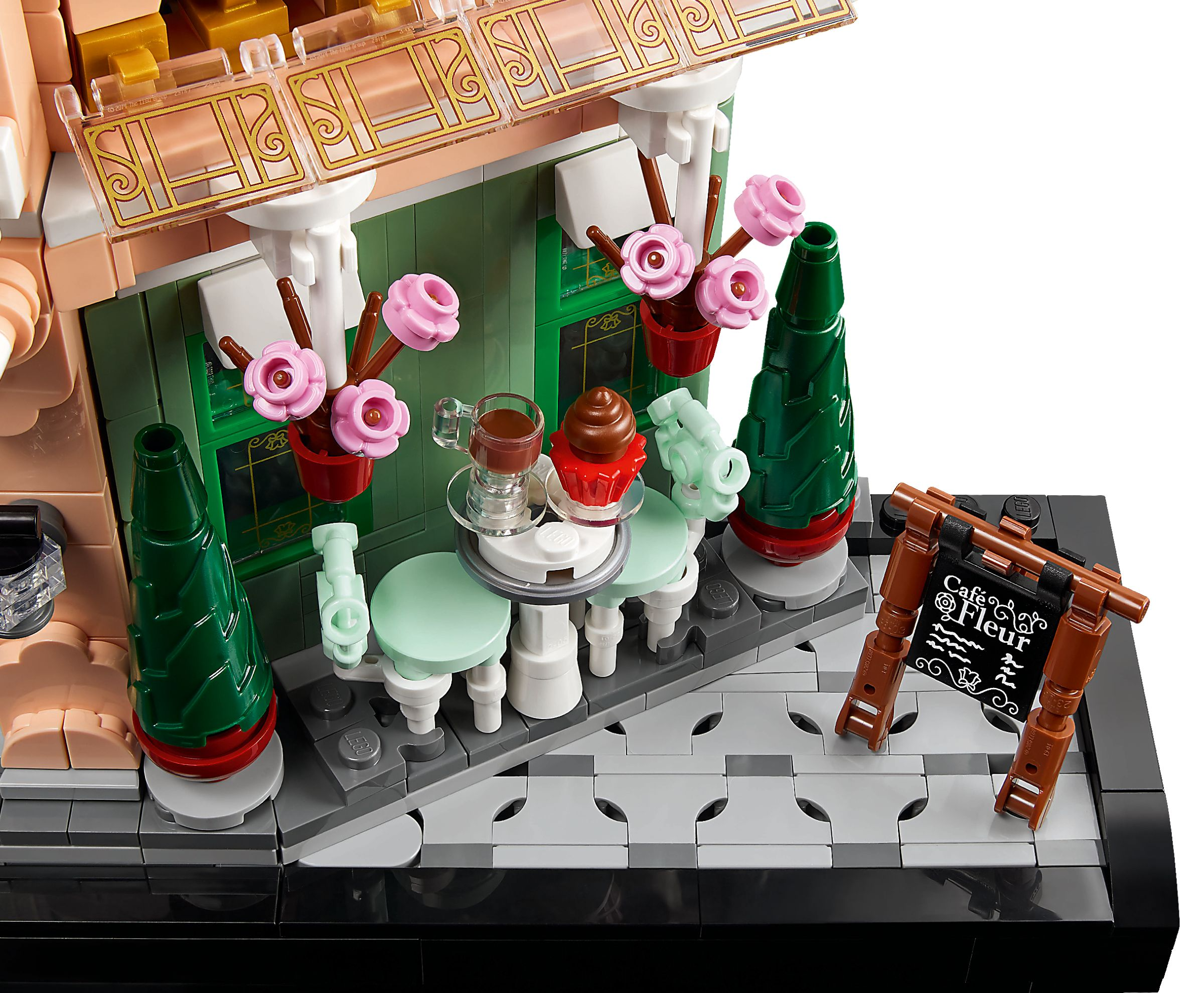 Lego-Café mit Tisch, Stuhl, Tasse, Cupcake und Schild.