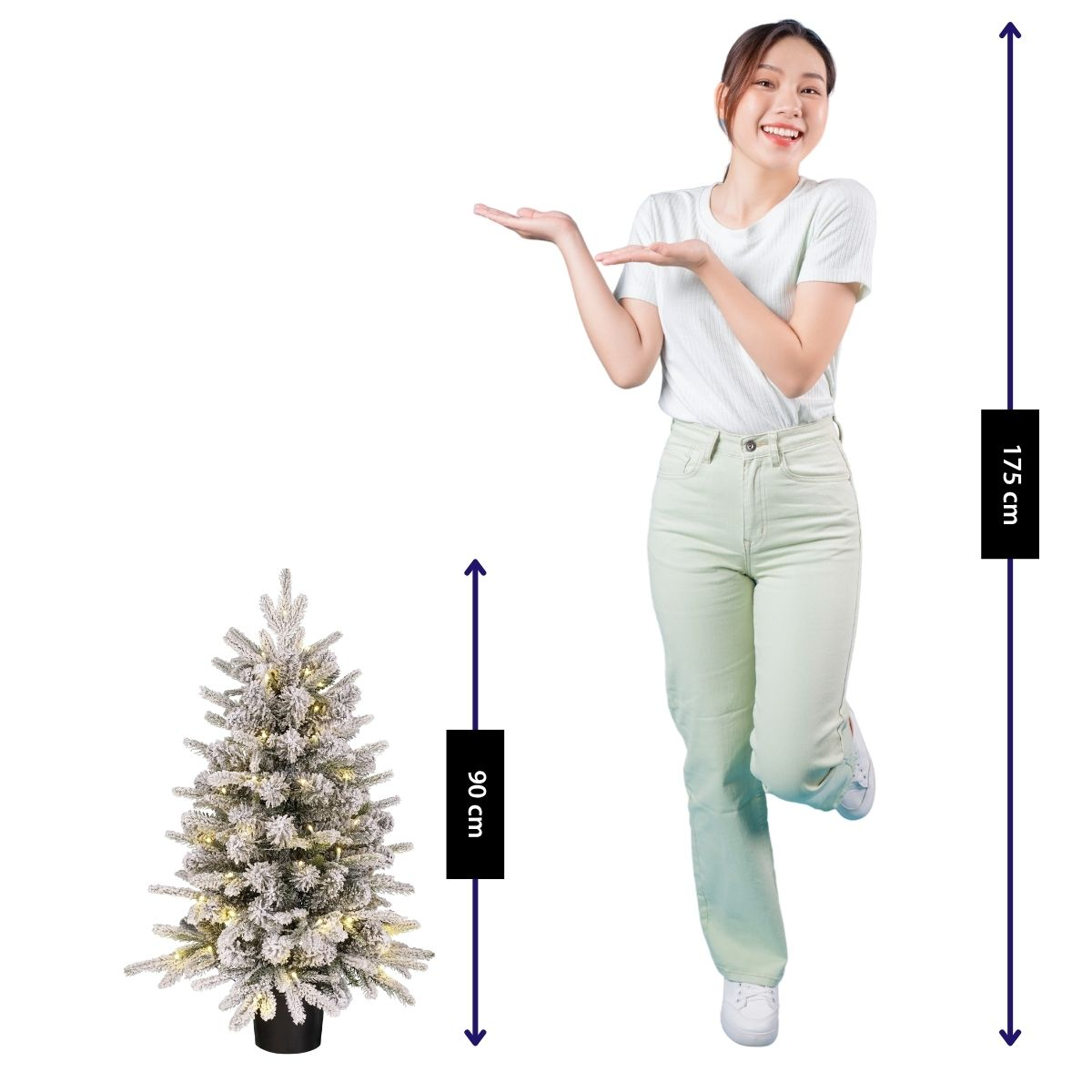 A woman next to a 90 cm Christmas tree. She is 175 cm tall.