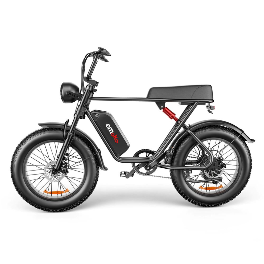 Bicicletta elettrica nera con pneumatici larghi e ammortizzatore rosso.