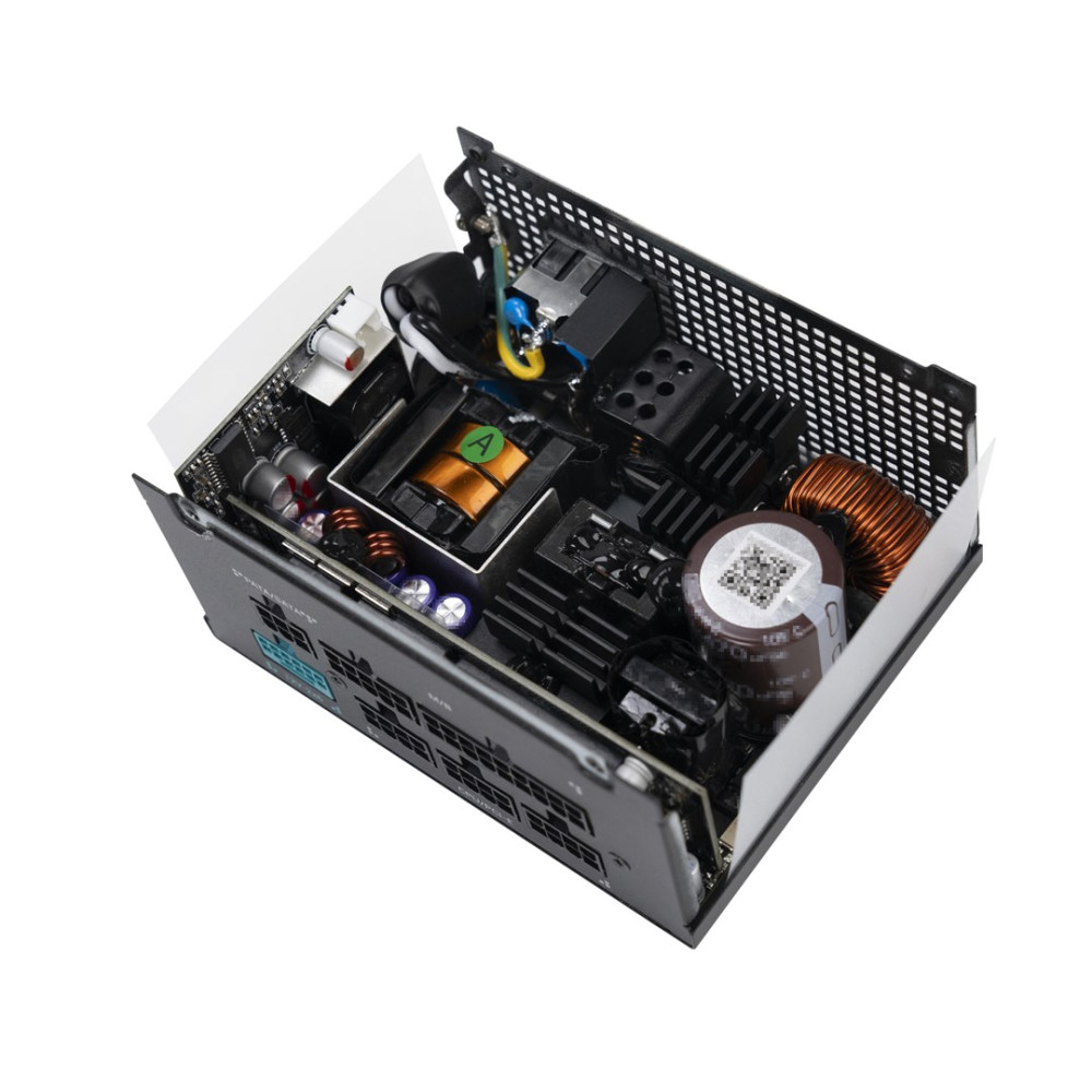 Un alimentatore per PC aperto con circuiti, bobine e condensatori.