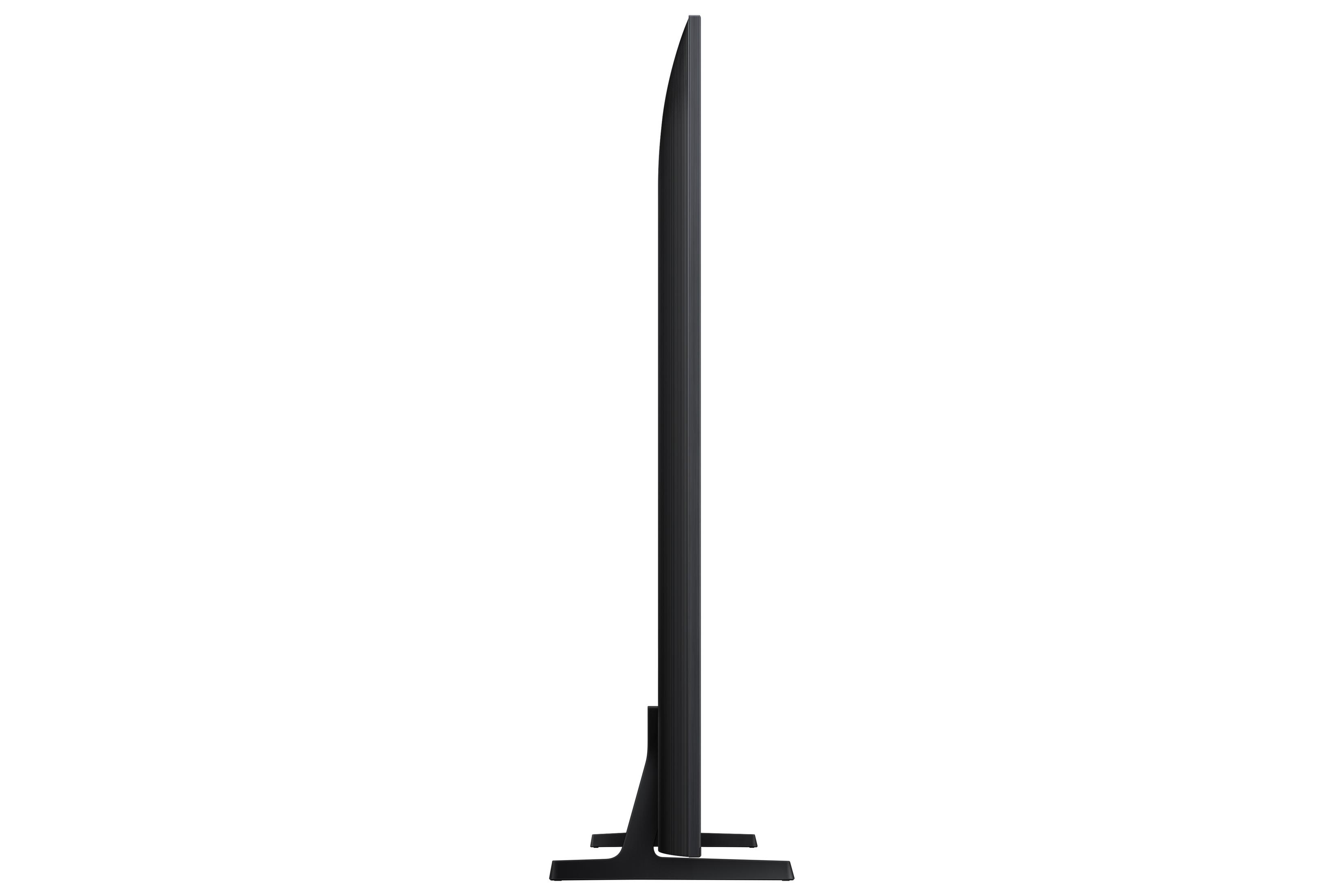 Un téléviseur noir fin avec un pied en forme de T, vu de côté.