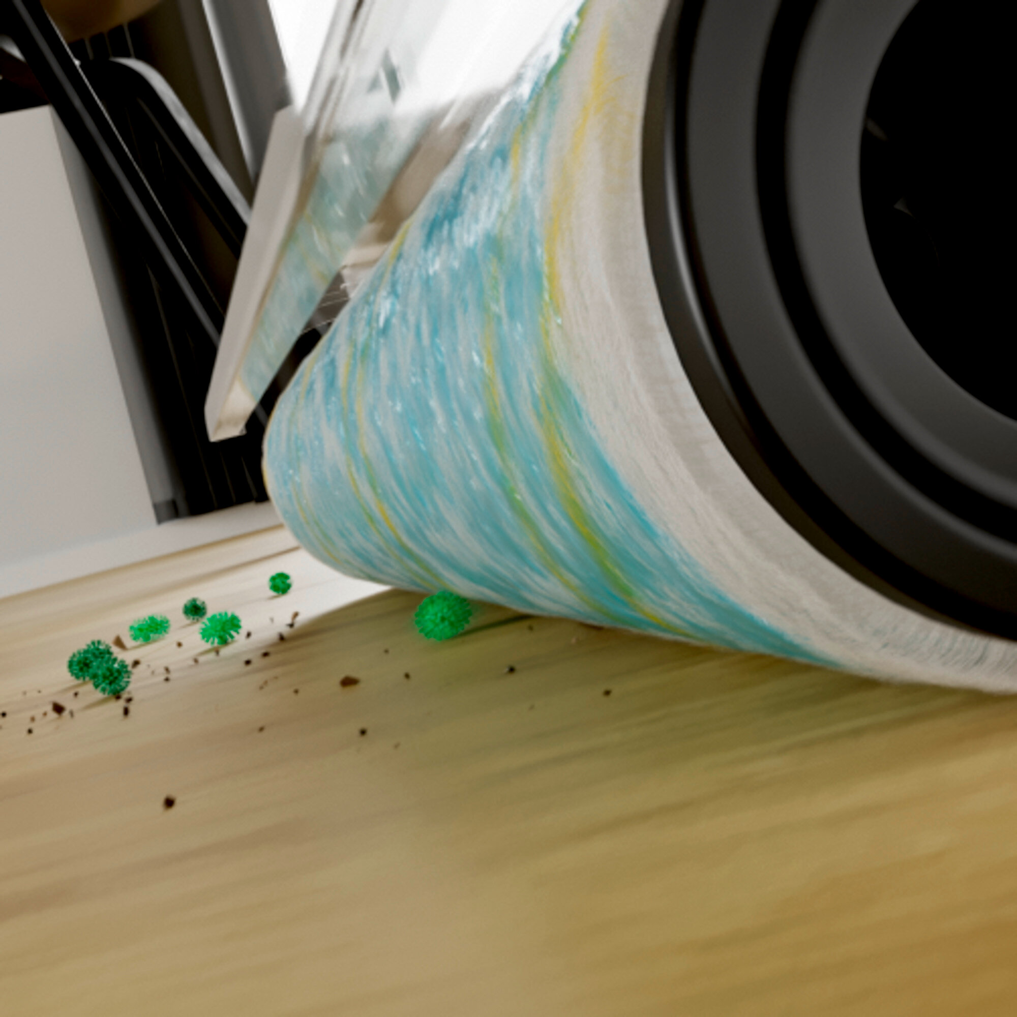 Una spazzola blu e gialla pulisce particelle verdi da un pavimento in legno.
