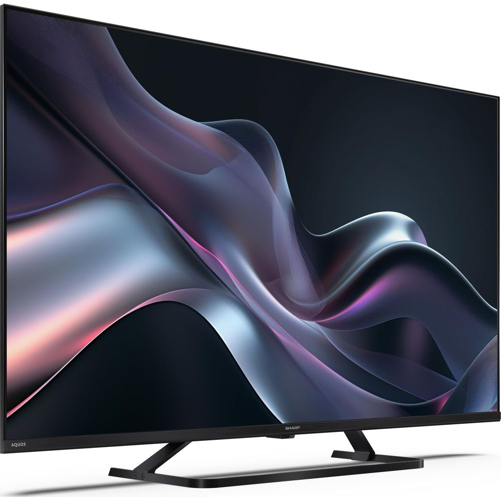 Un téléviseur noir affichant une image abstraite et ondulée aux teintes violettes et grises.