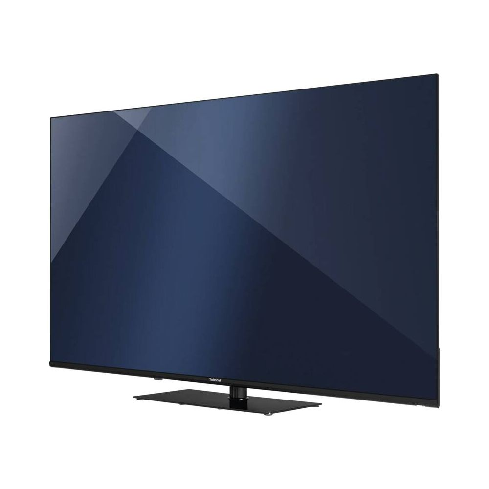 Un televisore a schermo piatto grande e scuro con un sottile supporto nero.