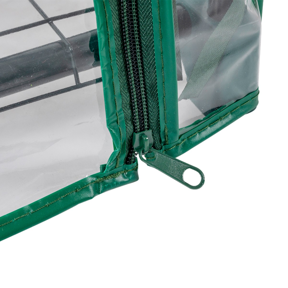 Green zipper on a clear greenhouse with a black metal frame.