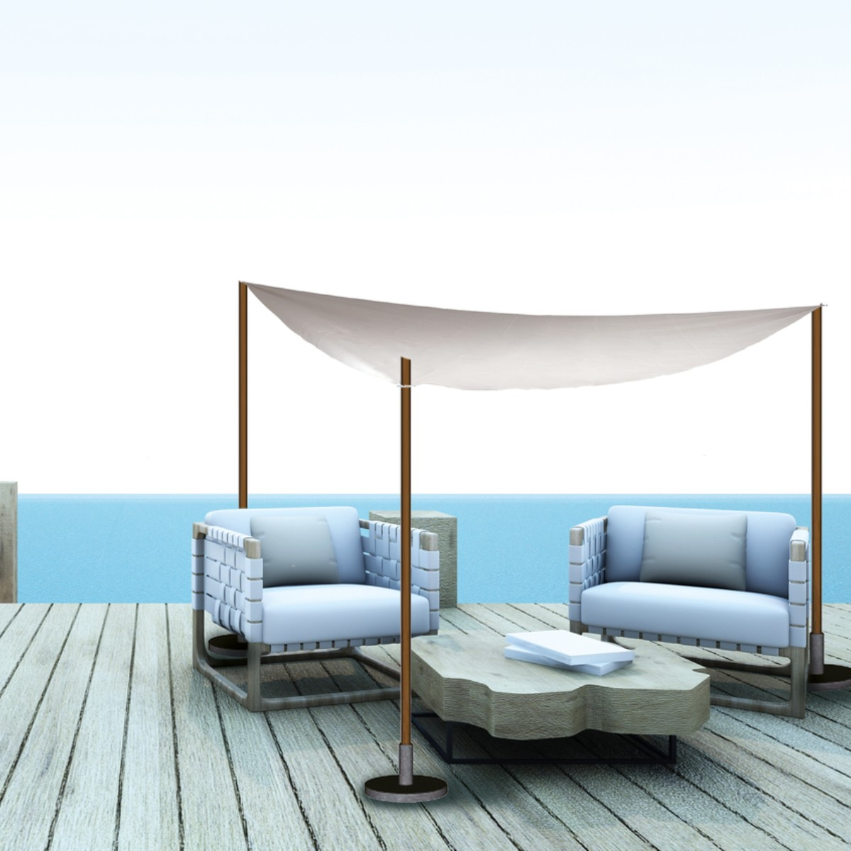 Two white armchairs with cushions on a wooden deck by the sea under a canopy.