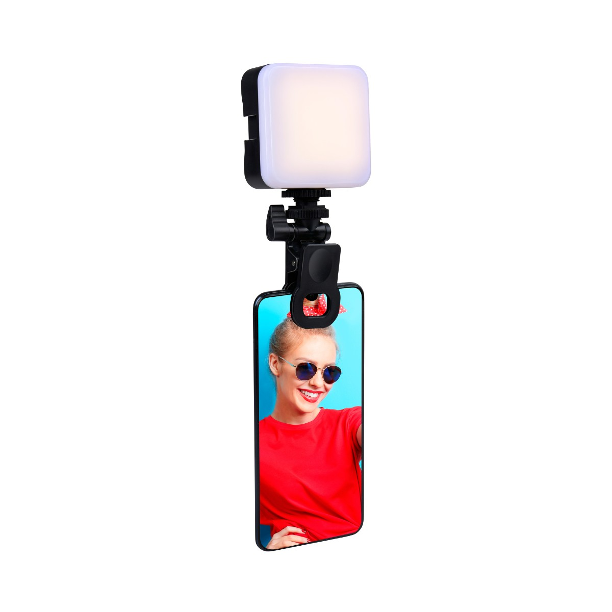 Een smartphone met een selfie ringlamp eraan bevestigd.