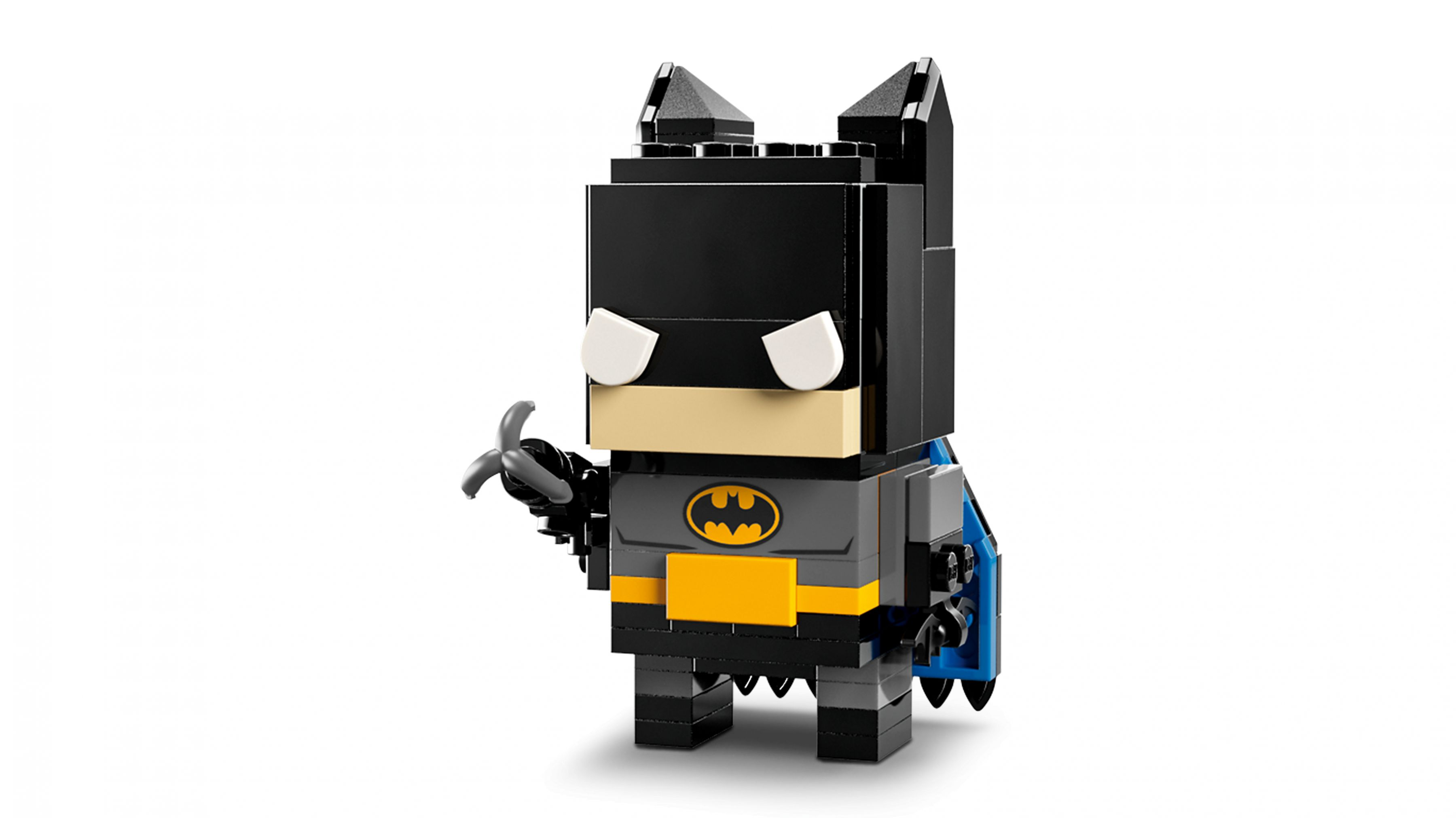 Una figura Lego Batman in nero con accenti gialli e mantello grigio.