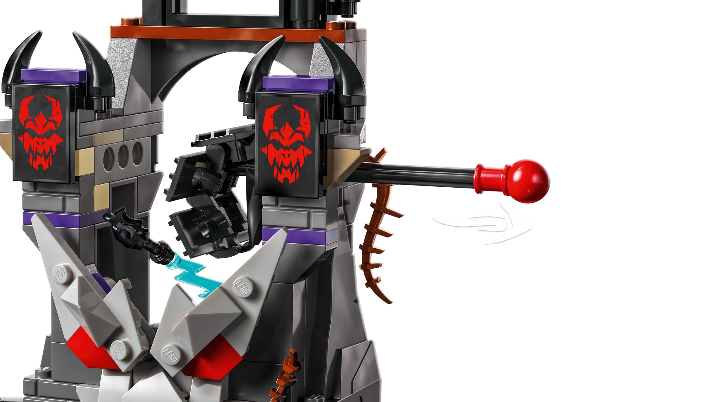 Una torre LEGO con pegatinas de calavera roja, cuernos y un lanzador de bolas rojo.