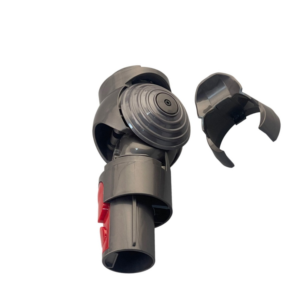 Grauer Dyson-Gelenkadapter mit roter Taste und separatem Halteclip.