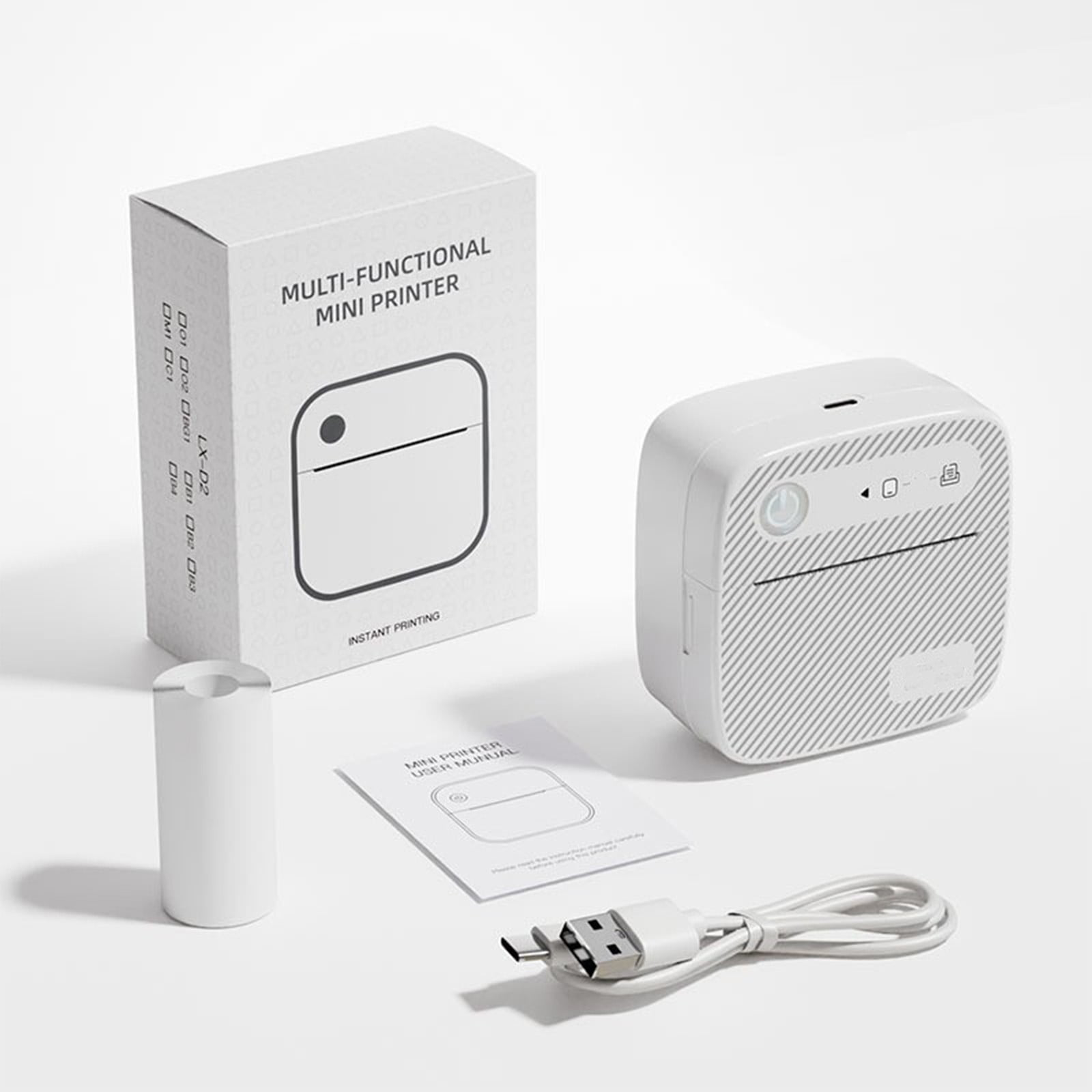 Weiße multifunktionale Mini-Drucker, Karton, Papierrolle, Handbuch und USB-Kabel auf weißer Oberfläche.