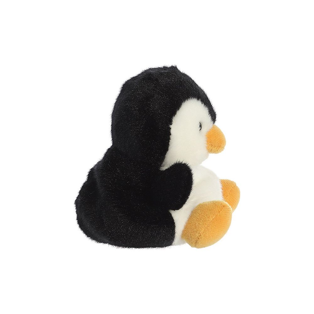 Ein flauschiger Stoffpinguin sitzt seitlich, schwarz und weiß mit orangefarbenem Schnabel und Füßen.