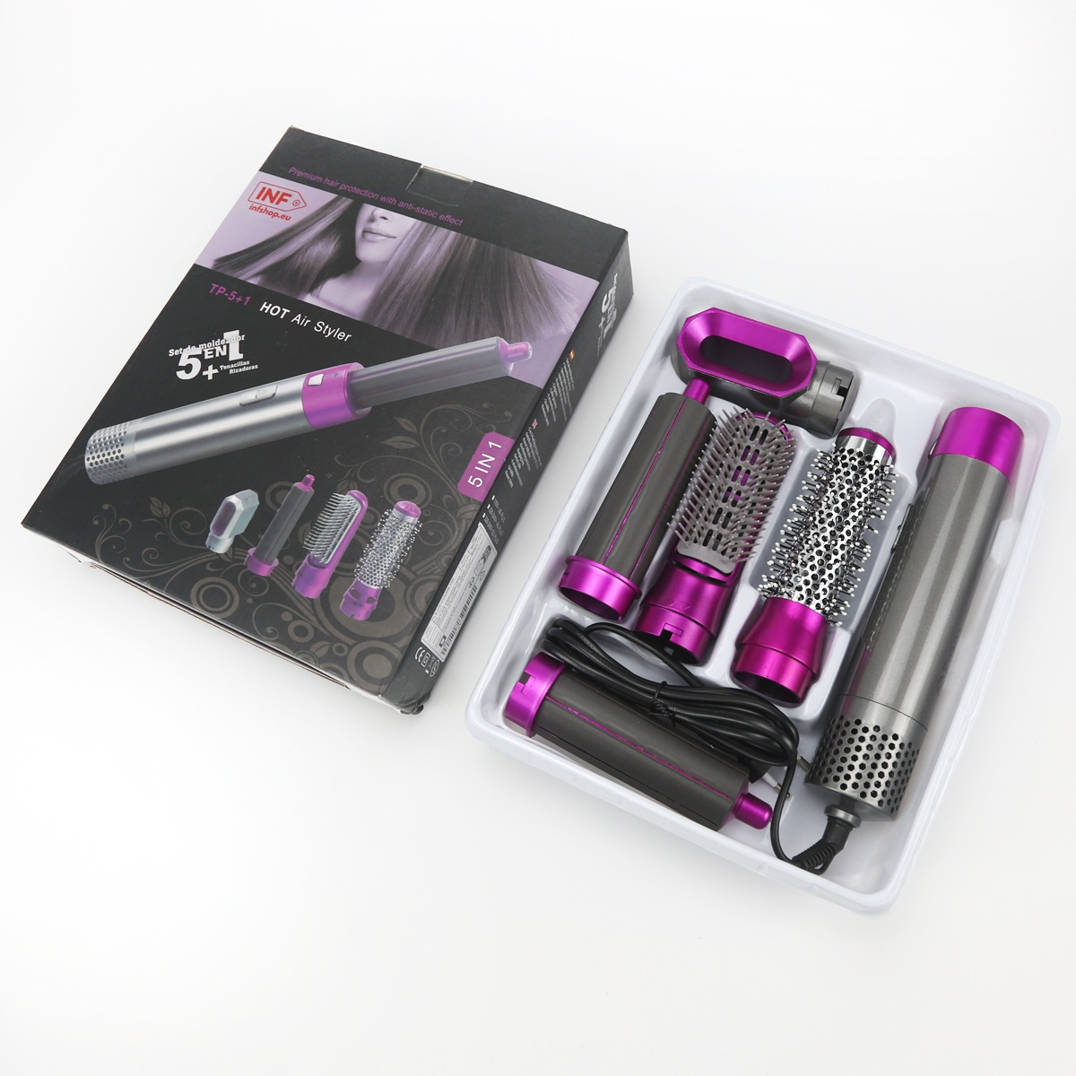 Ein 5-in-1-Heißluftstyler-Set mit verschiedenen Aufsätzen in einer Verpackung.