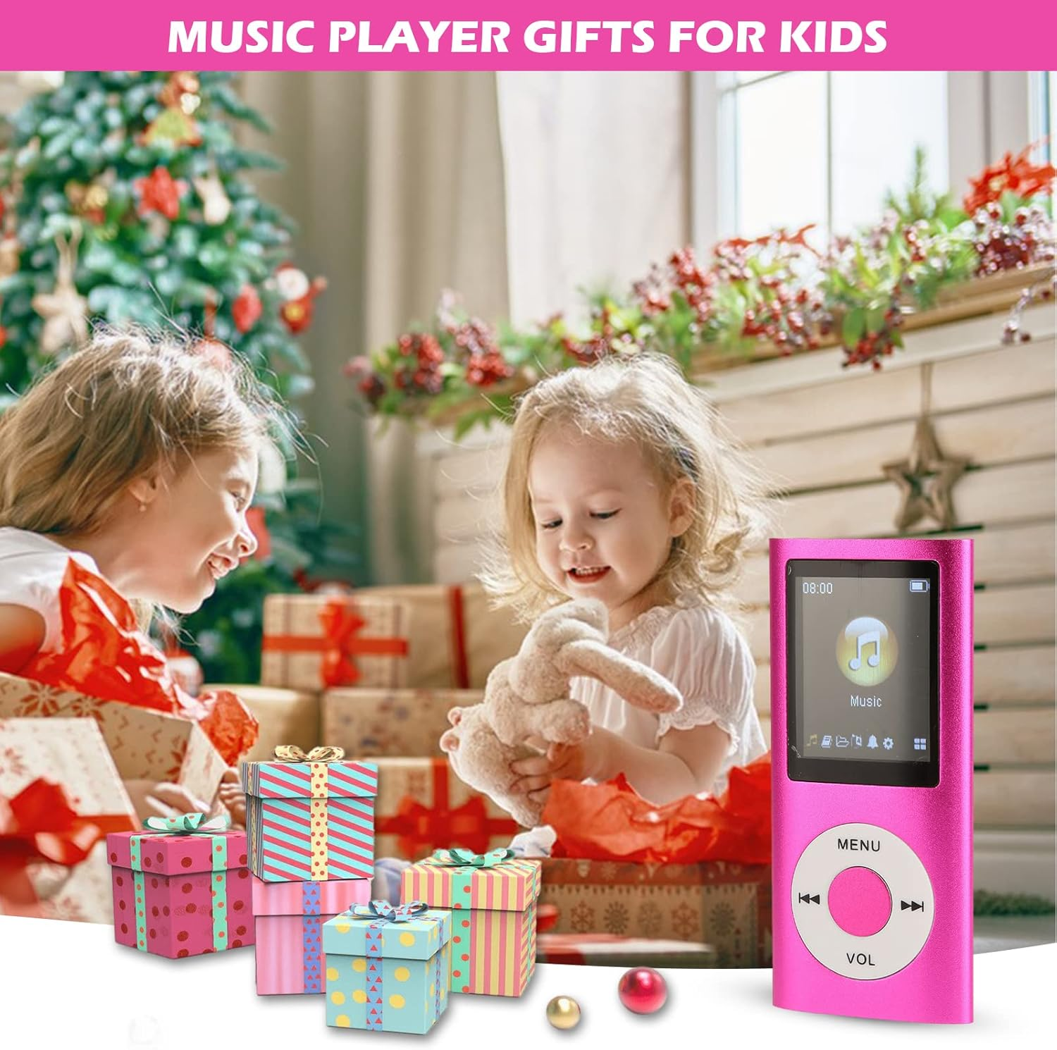 Zwei Kinder packen Geschenke aus, ein rosa MP3-Player liegt daneben.