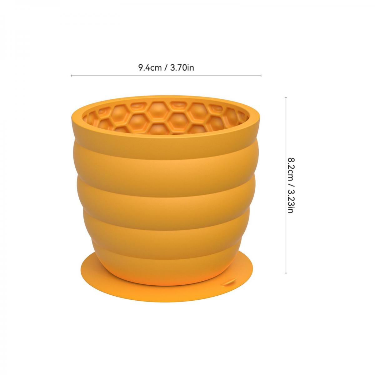 Ein orangefarbener Eiswürfelbehälter mit Honigwabenmuster und Maßen.