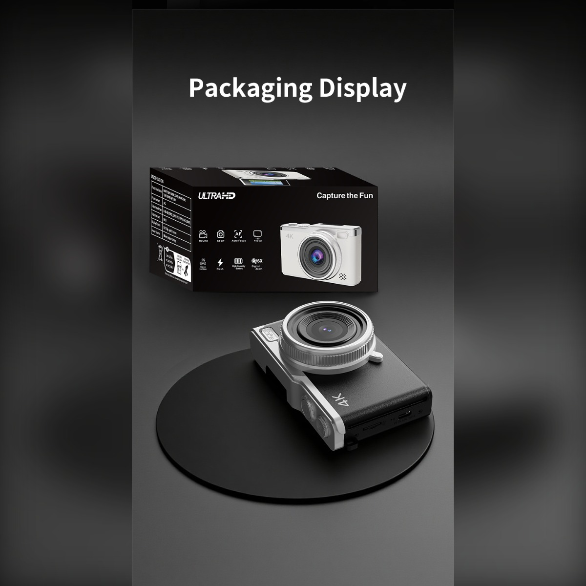 Eine weiße und schwarze Digitalkamera und ihre Verpackung werden auf einer dunklen Oberfläche präsentiert.