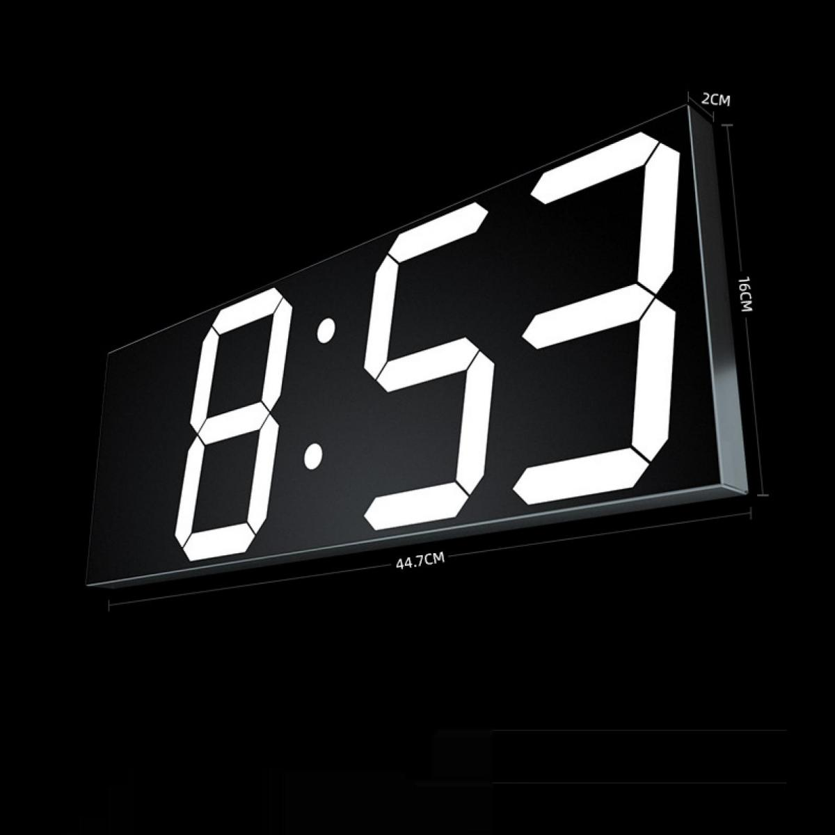 Ein digitaler Wecker zeigt 8:53 an. Maße: 44,7cm x 16cm x 2cm.