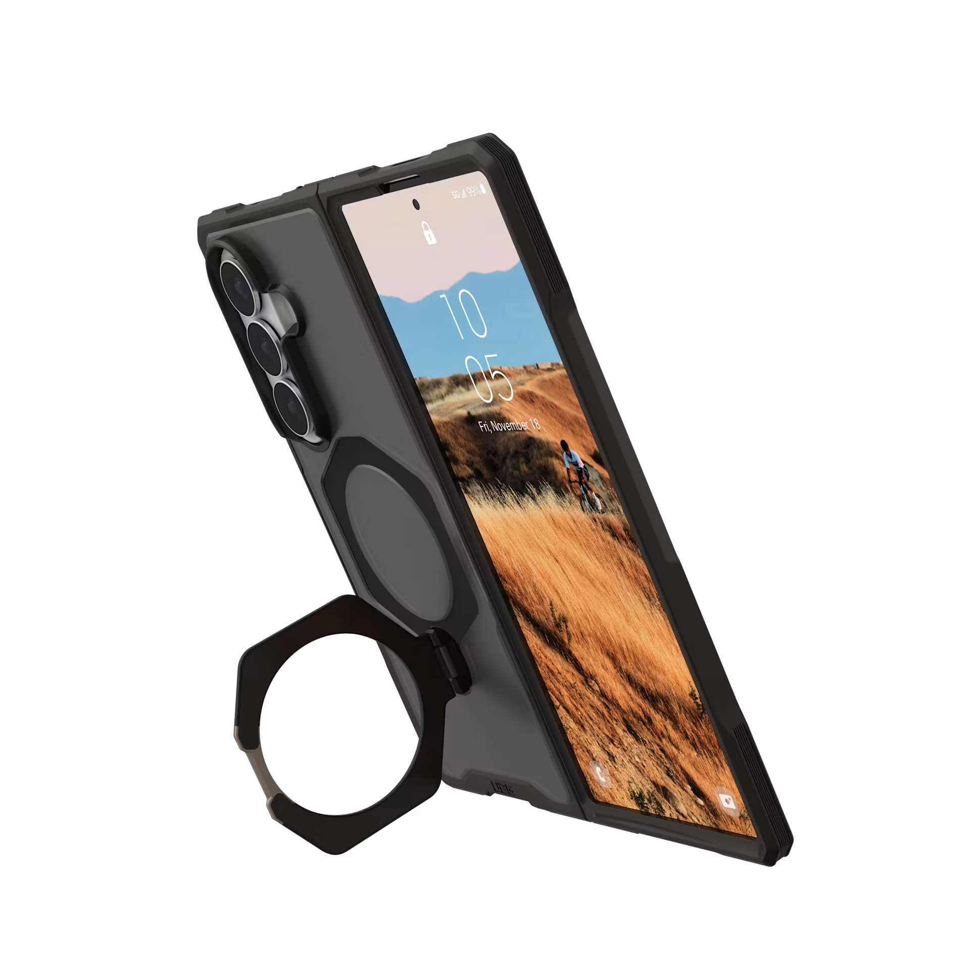 Teléfono inteligente negro con soporte de anillo integrado y fondo de pantalla de paisaje montañoso.