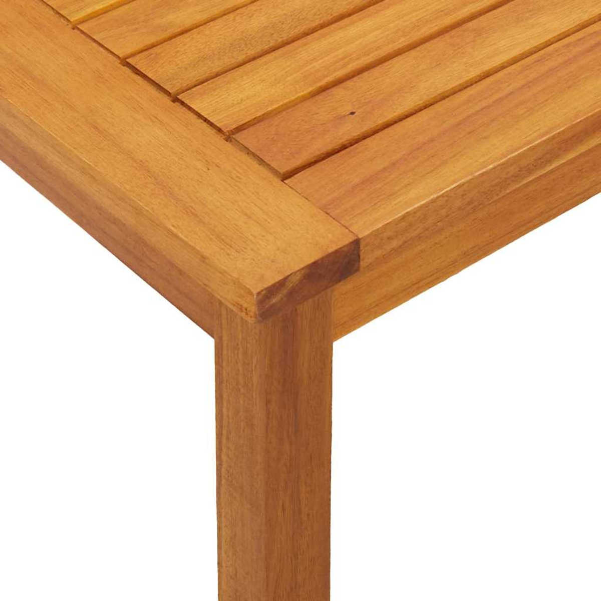 Esquina de mesa de madera con tapa ranurada y pata, vista cercana.
