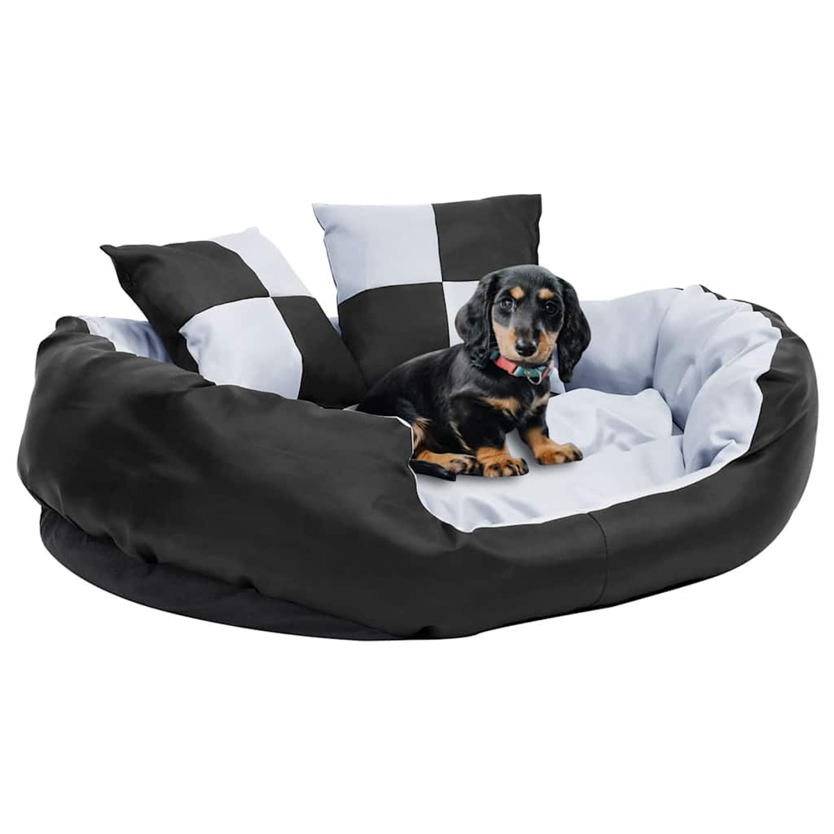 Ein Dackelwelpe sitzt in einem runden Hundebett mit schwarz-weißen Kissen.