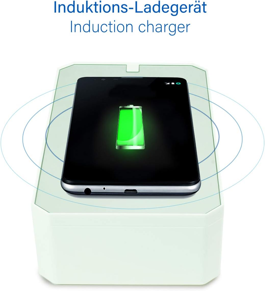 Ein Smartphone lädt auf einem weißen Induktionsladegerät mit einem grünen Akkusymbol.