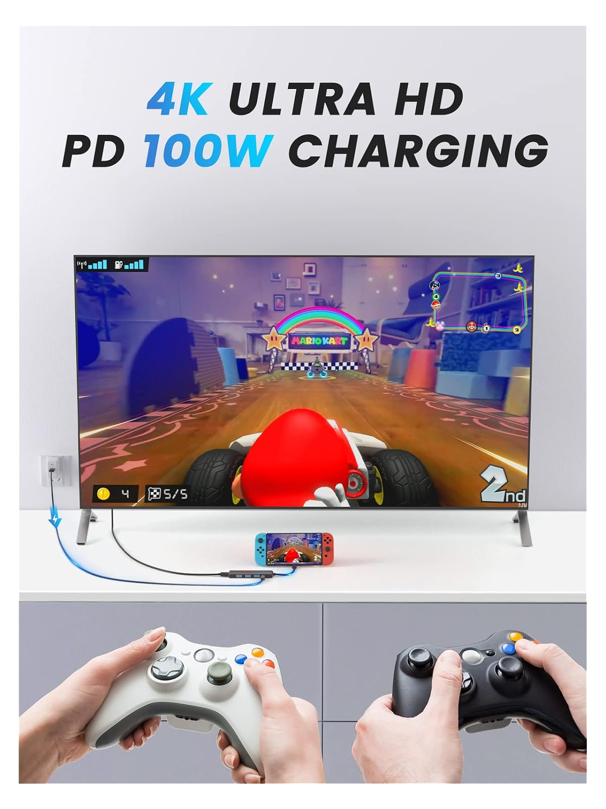 Ein großer Fernseher zeigt Mario Kart. Ein Nintendo Switch ist angeschlossen und lädt.