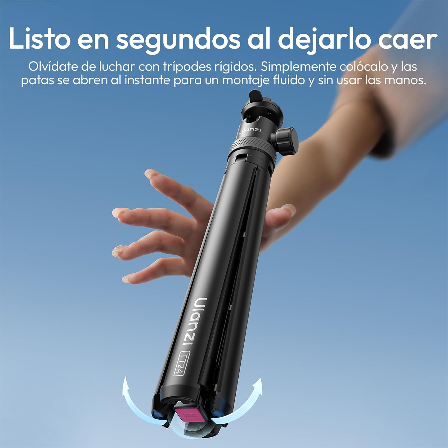Un trípode negro sostenido por una mano. Una flecha indica la apertura de las patas.