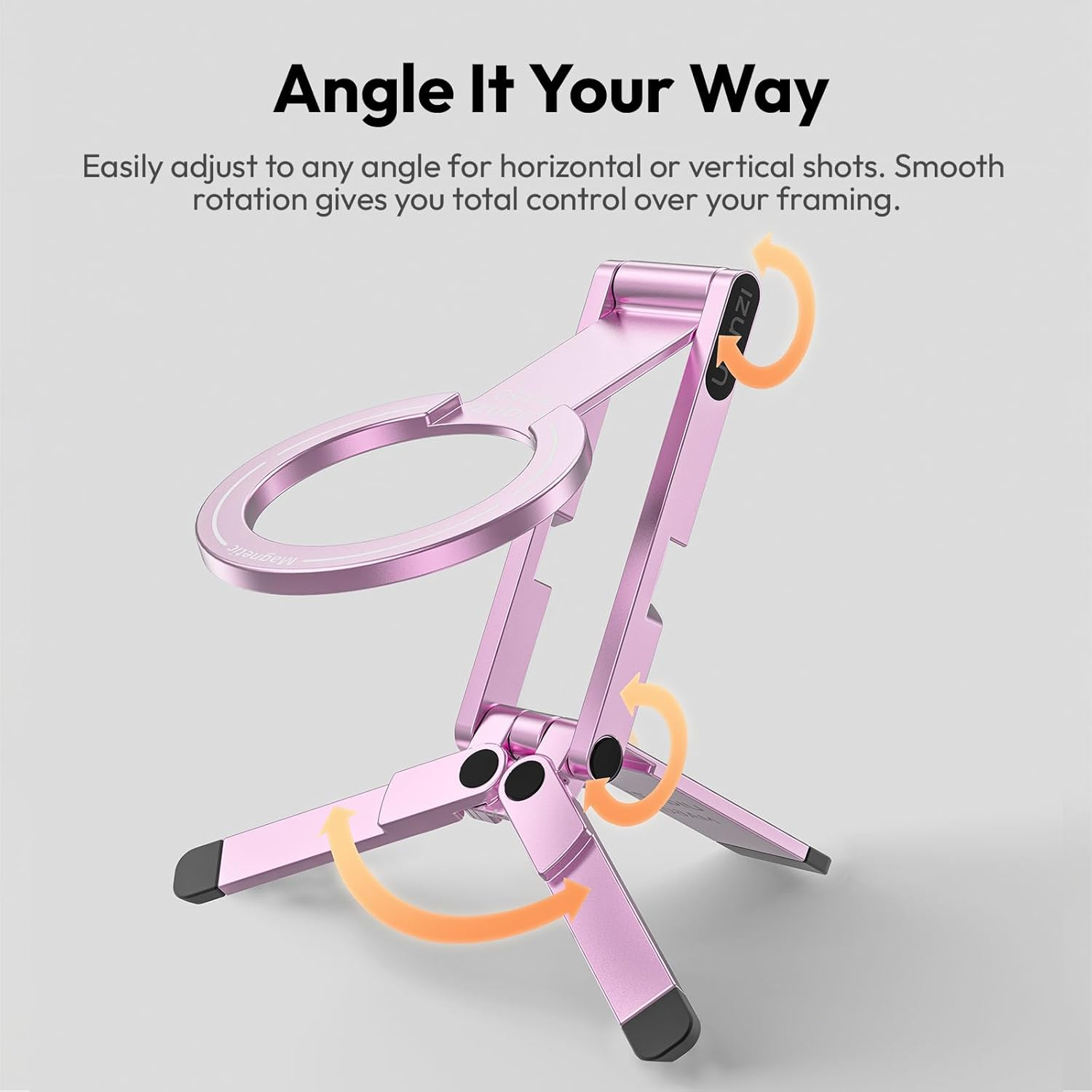 Soporte rosa ajustable para teléfono con flechas que indican rotación. Texto: Angúlelo a su manera.