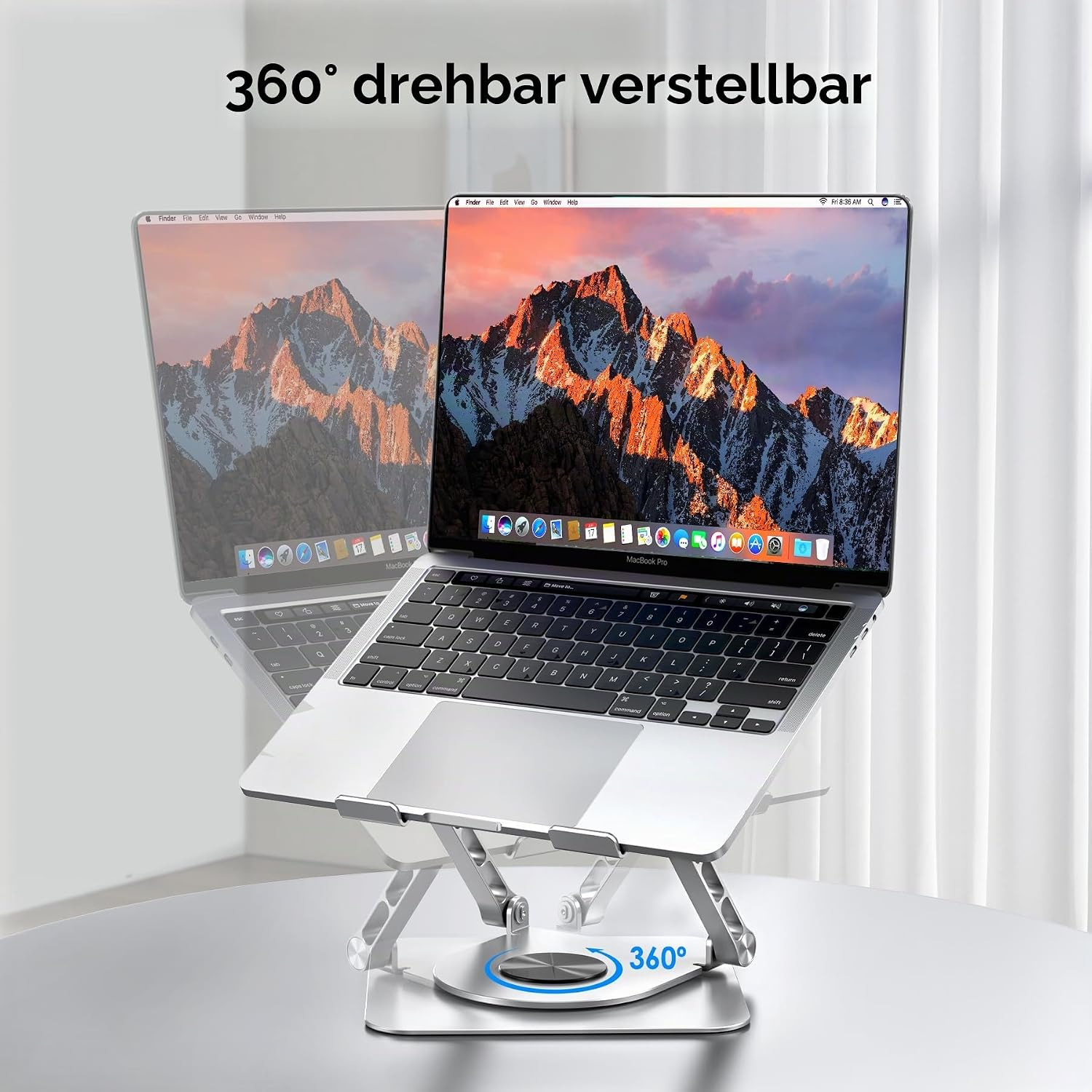 Silberner Laptopständer mit 360° drehbarer Basis hält einen MacBook Pro.