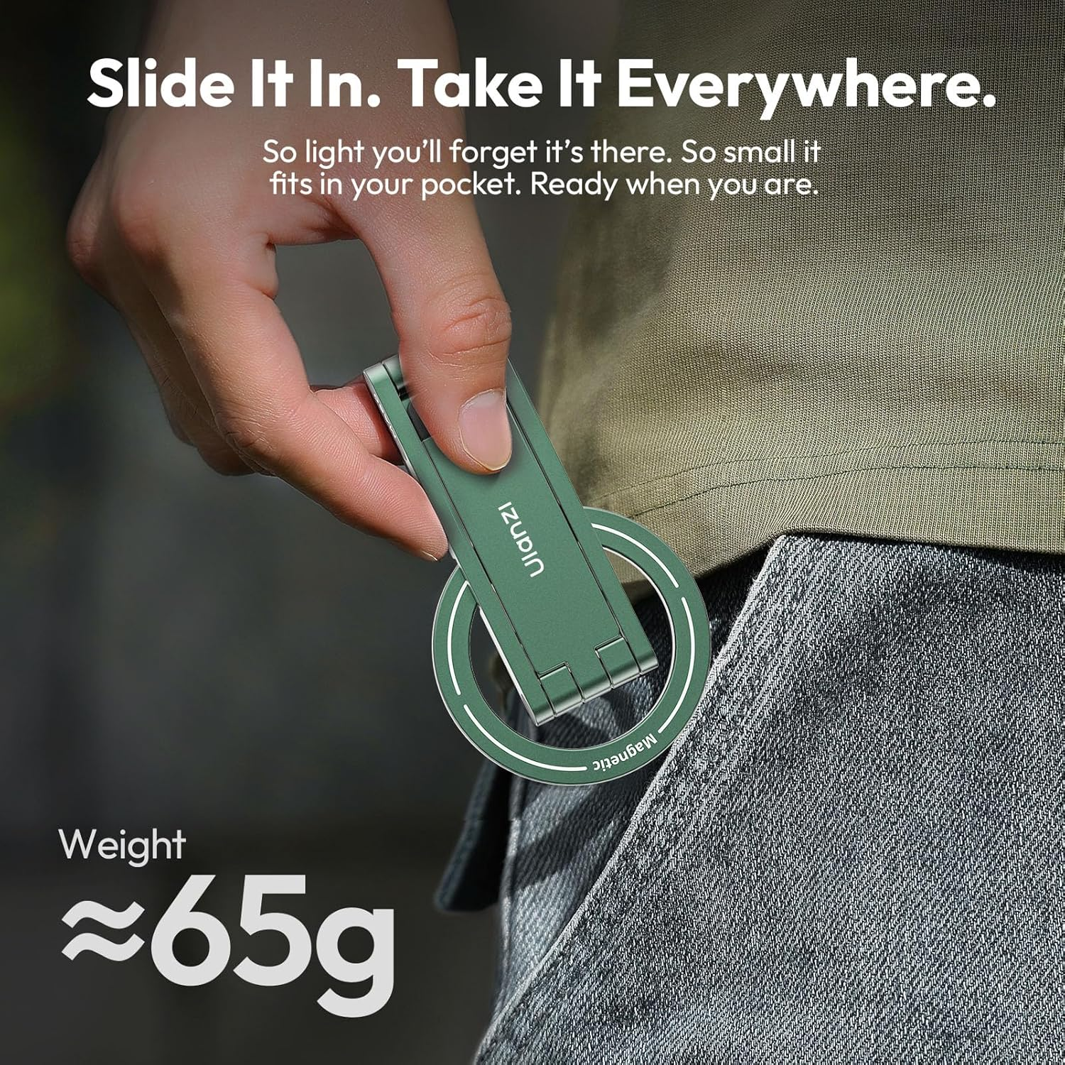 Soporte verde para teléfono, aprox. 65g, sujeto por una mano.