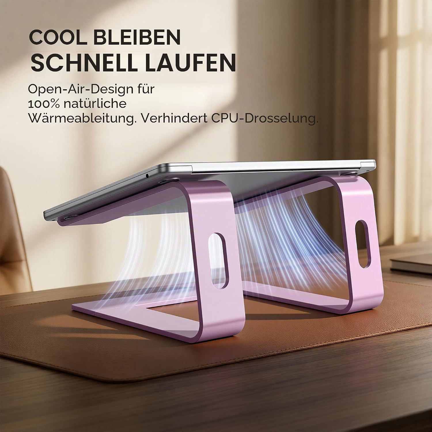 Ein rosa Laptop-Ständer mit Luftstrom-Grafik auf einem Schreibtisch.