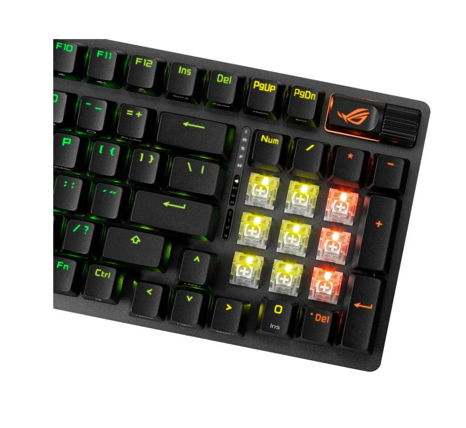 Primer plano de un teclado negro con teclas iluminadas. Se ven interruptores amarillos y rojos.