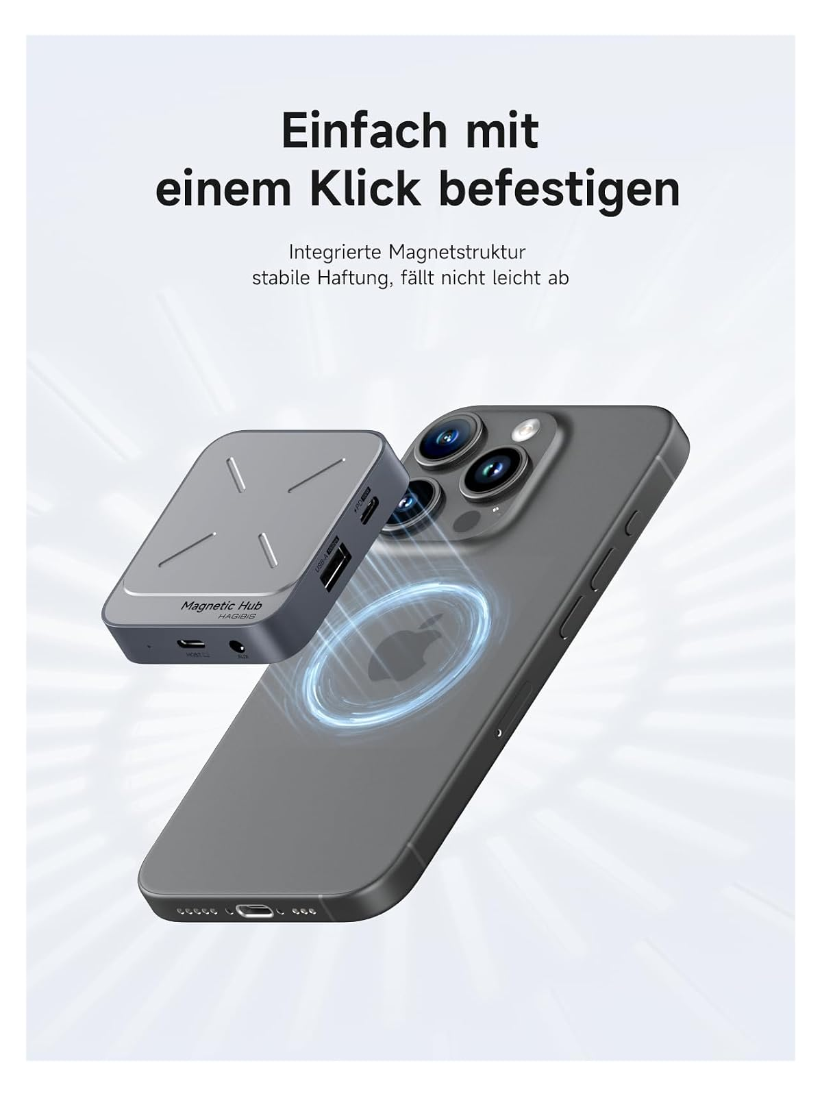 Ein grauer Magnet-Hub schwebt über der Rückseite eines grauen Smartphones mit sichtbaren Kameraobjektiven.
