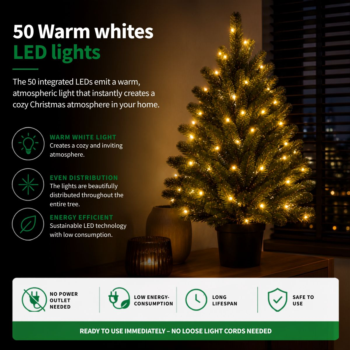 A lit artificial Christmas tree in a pot with product features listed on the side.