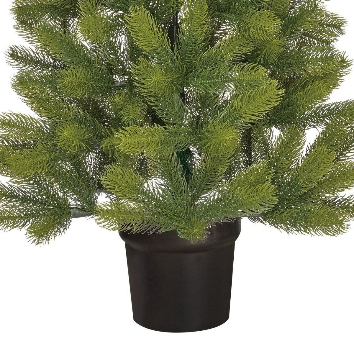 An artificial green pine tree stands inside a simple brown pot.
