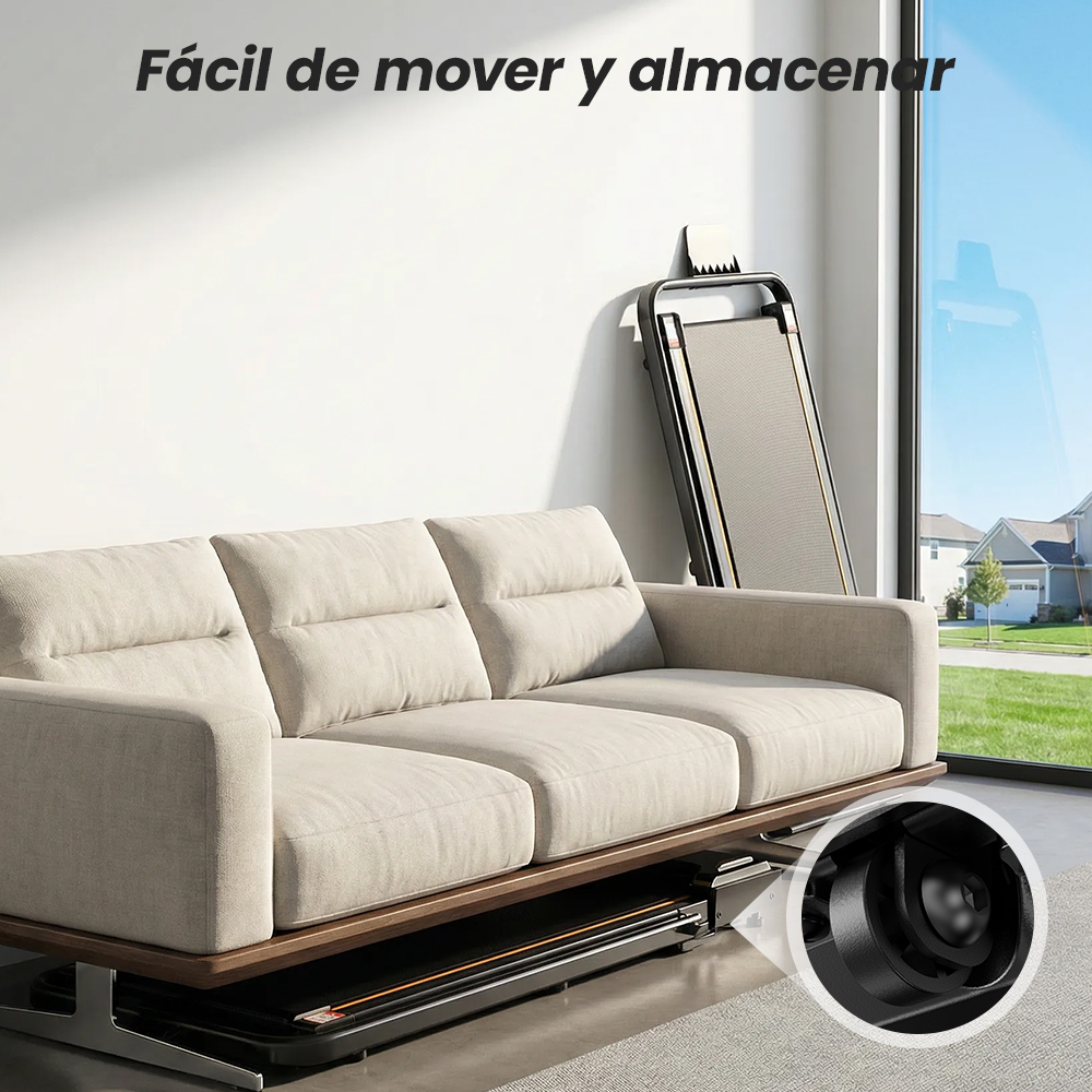 Un sofá beige en una sala luminosa, con una caminadora plegada guardada verticalmente detrás y horizontalmente debajo.