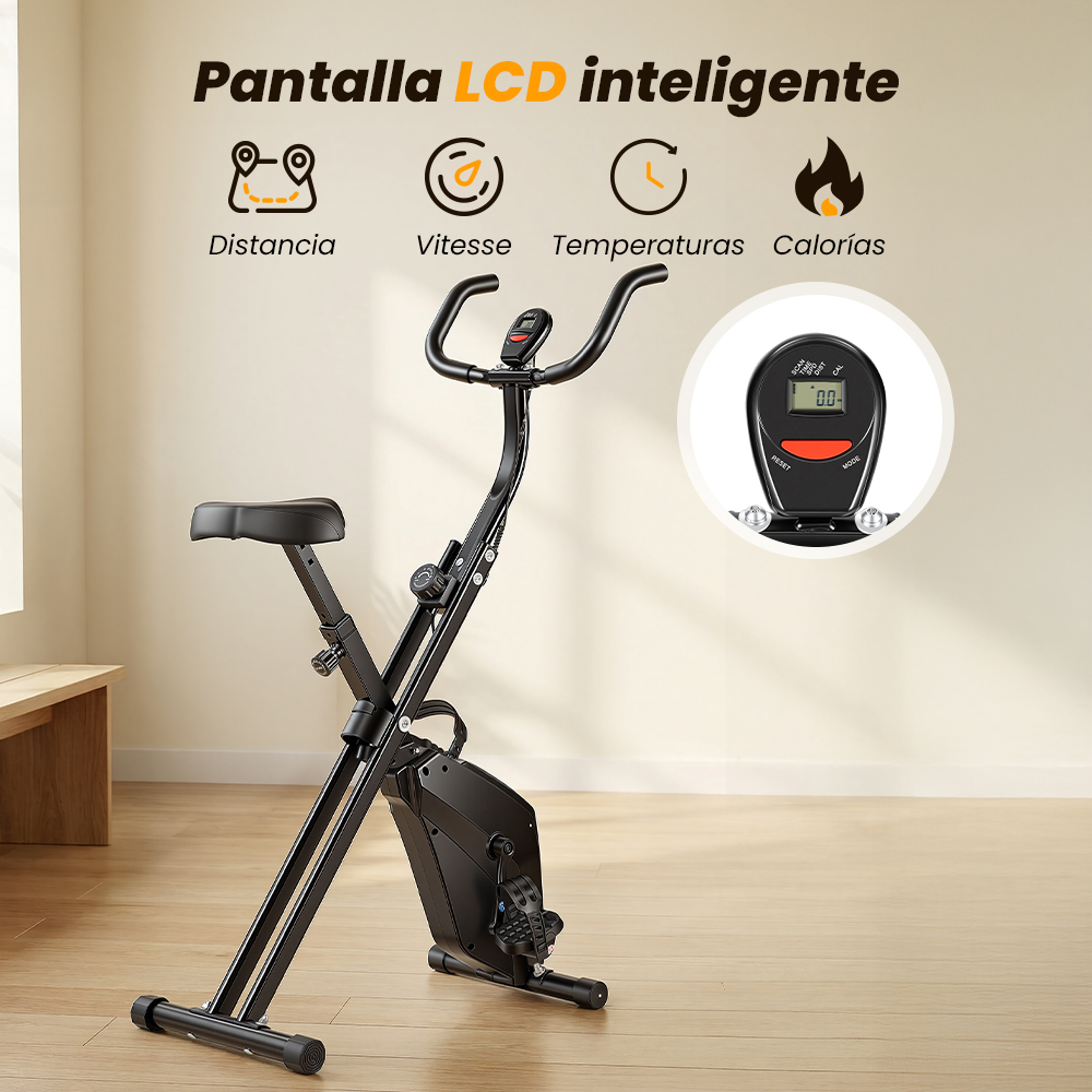Una bicicleta estática negra con marco plegable sobre suelo de madera, con una pantalla LCD arriba.