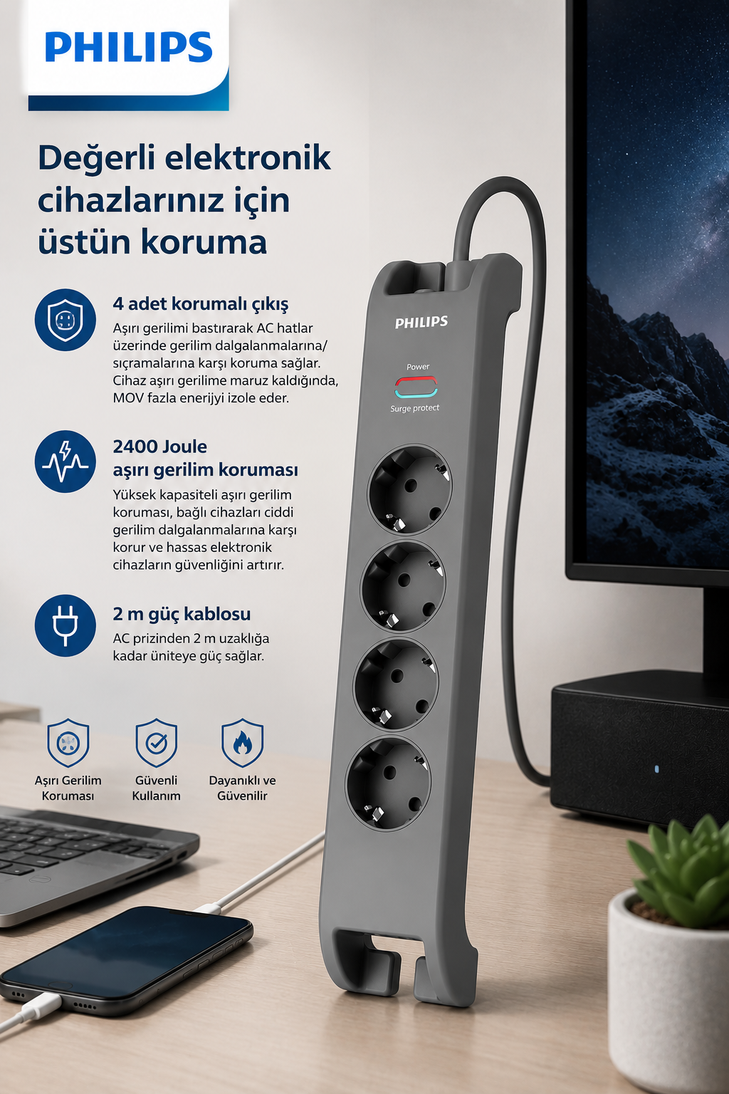 Dört çıkışlı ve koruma özellikli gri Philips uzatma kablosu, açıklayıcı metnin yanında masada duruyor.