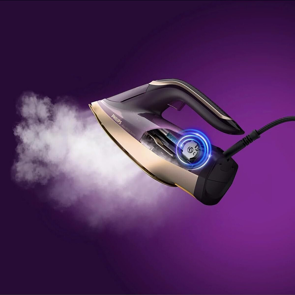 Mor ve altın rengi Philips buharlı ütü, mor arka planda buhar bulutu çıkarıyor.