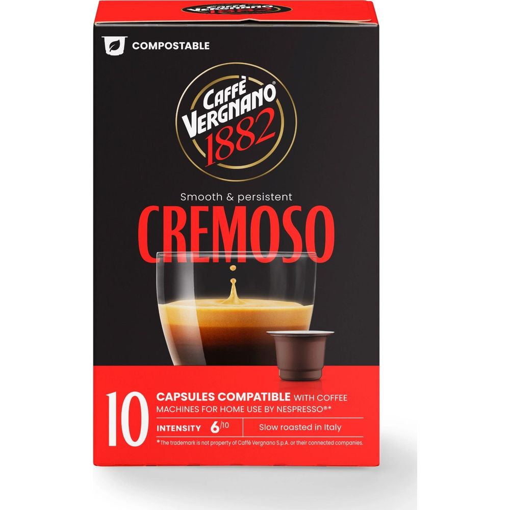 Scatola di capsule di caffè Caffe Vergnano 1882 Cremosso nera e rossa con tazzina di espresso e una capsula.