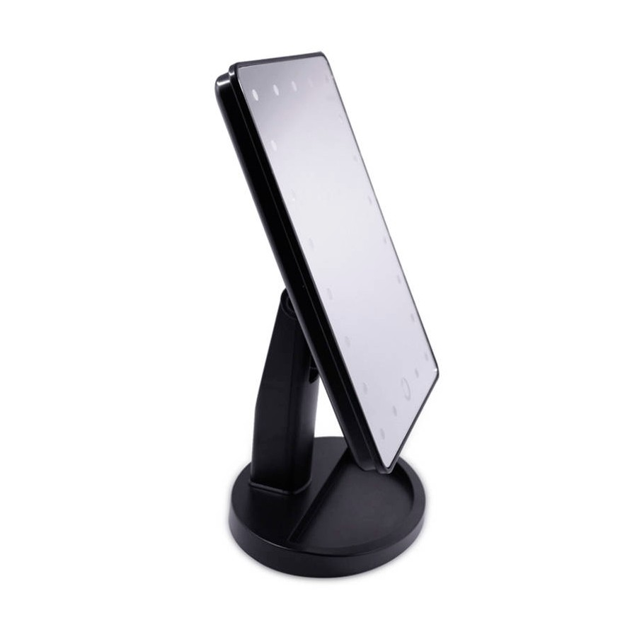Uno specchio da trucco rettangolare nero illuminato con supporto e base rotonda su sfondo bianco.