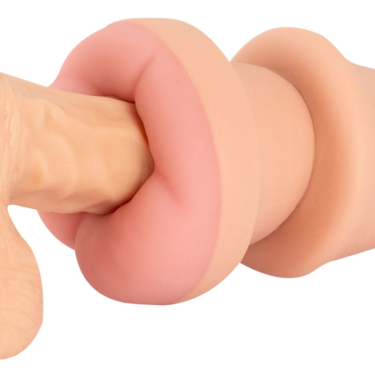 Nahaufnahme eines rosa und beigen, strukturierten Sexspielzeugs aus Silikon vor weißem Hintergrund.