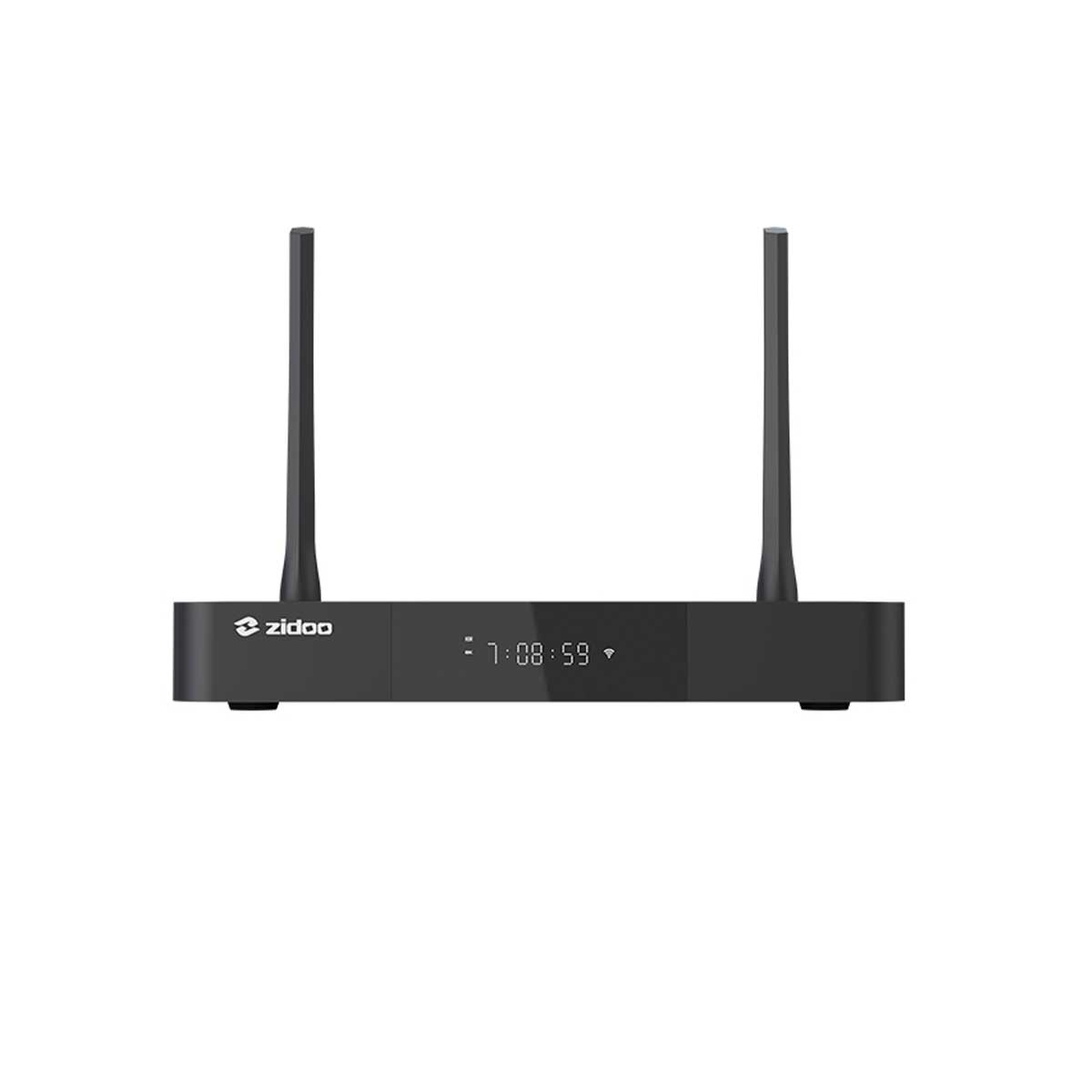 Un reproductor multimedia Zidoo negro con dos antenas verticales y una pantalla digital sobre fondo blanco.