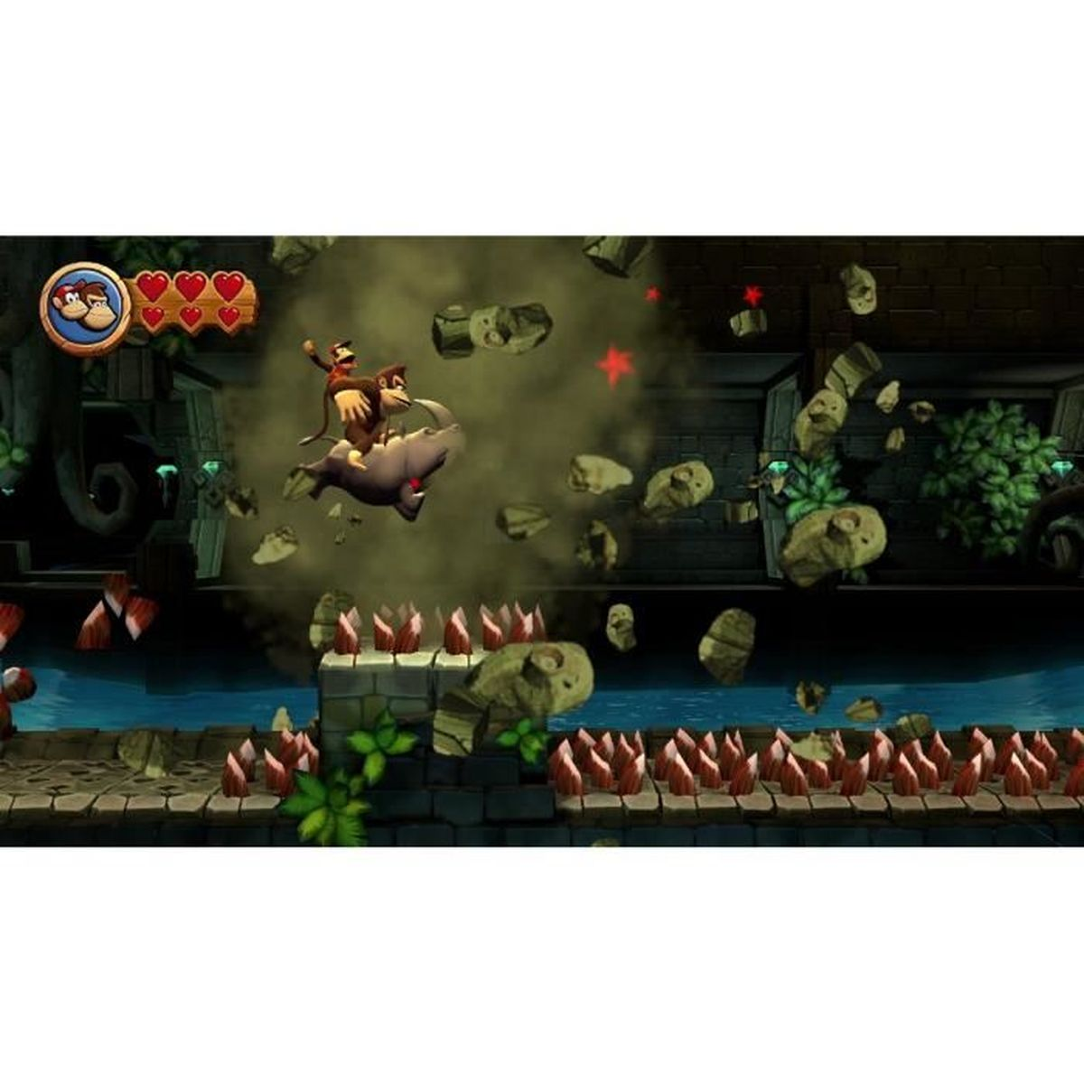Donkey Kong cavalca un rinoceronte distruggendo rocce sopra le punte.