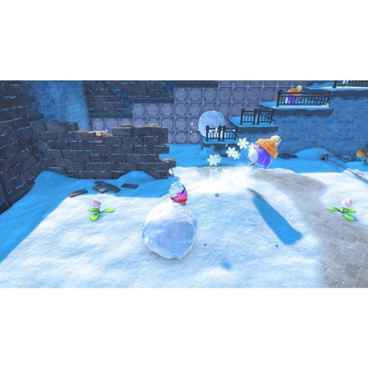 Personajes luchan en la nieve frente a una pared de ladrillos en un videojuego.