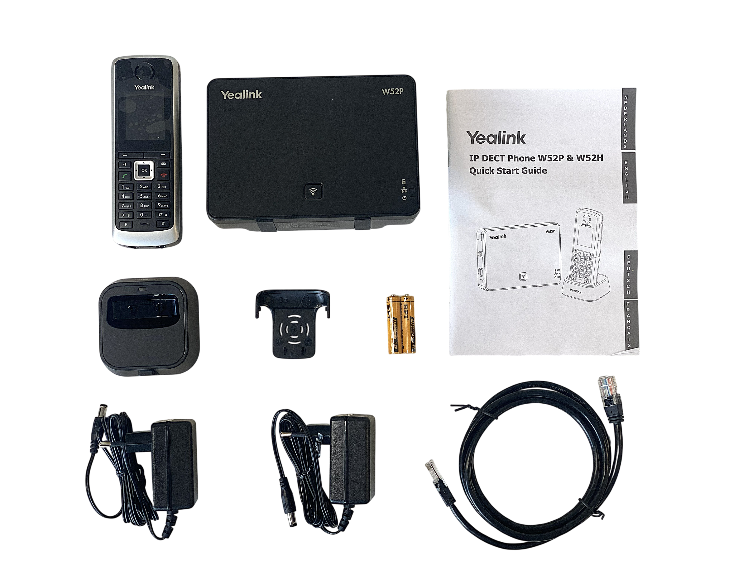 Zestaw telefonu IP DECT Yealink W52P i W52H z stacją bazową, słuchawką, ładowarką, zasilaczami i instrukcją.