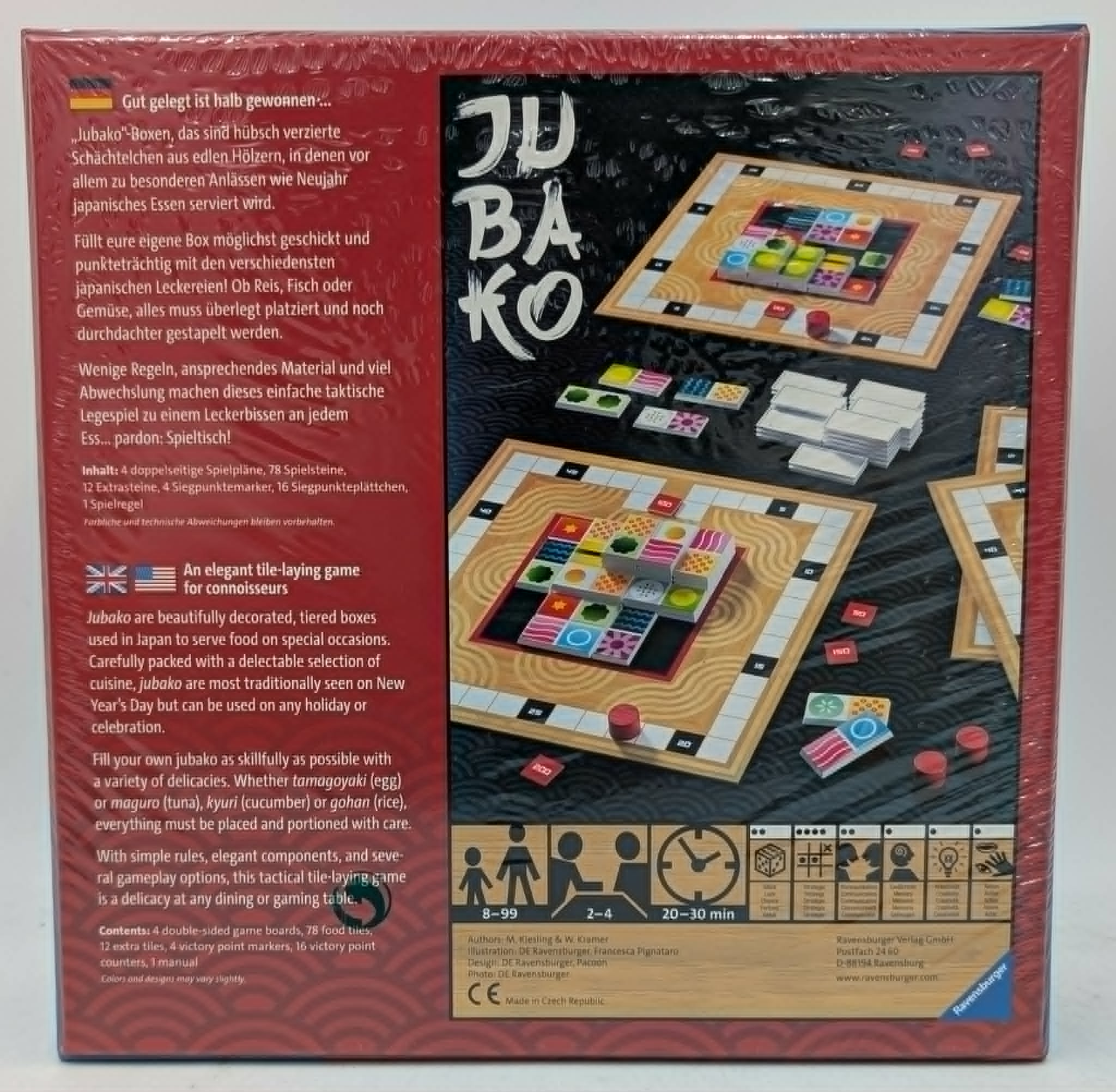Rückseite der 'Jubako' Brettspielschachtel mit Spielkomponenten, Plänen, Regeln auf Deutsch und Englisch.