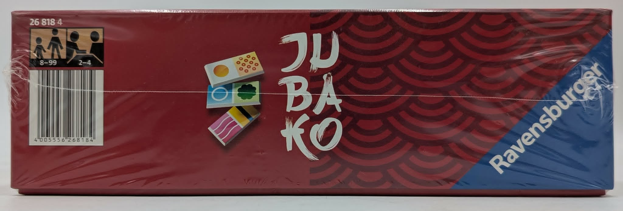 Rote Seite einer Ravensburger Jubako Spielverpackung mit Barcode und Muster.