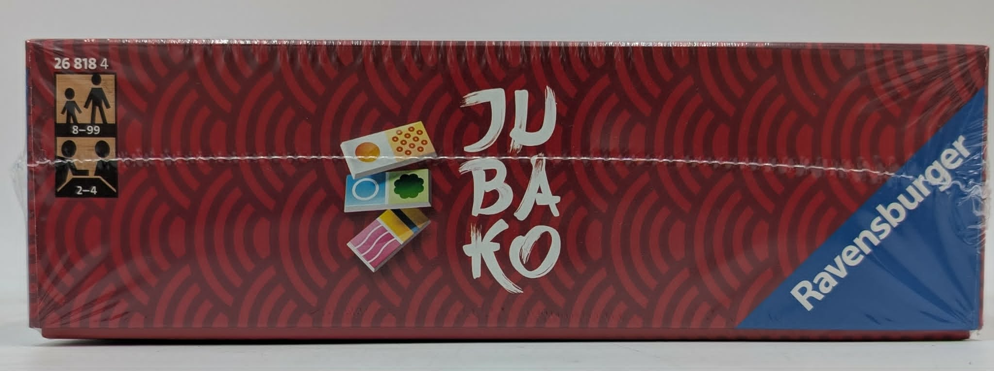 Seite der roten JUBAKO-Brettspielschachtel von Ravensburger mit japanischem Muster.