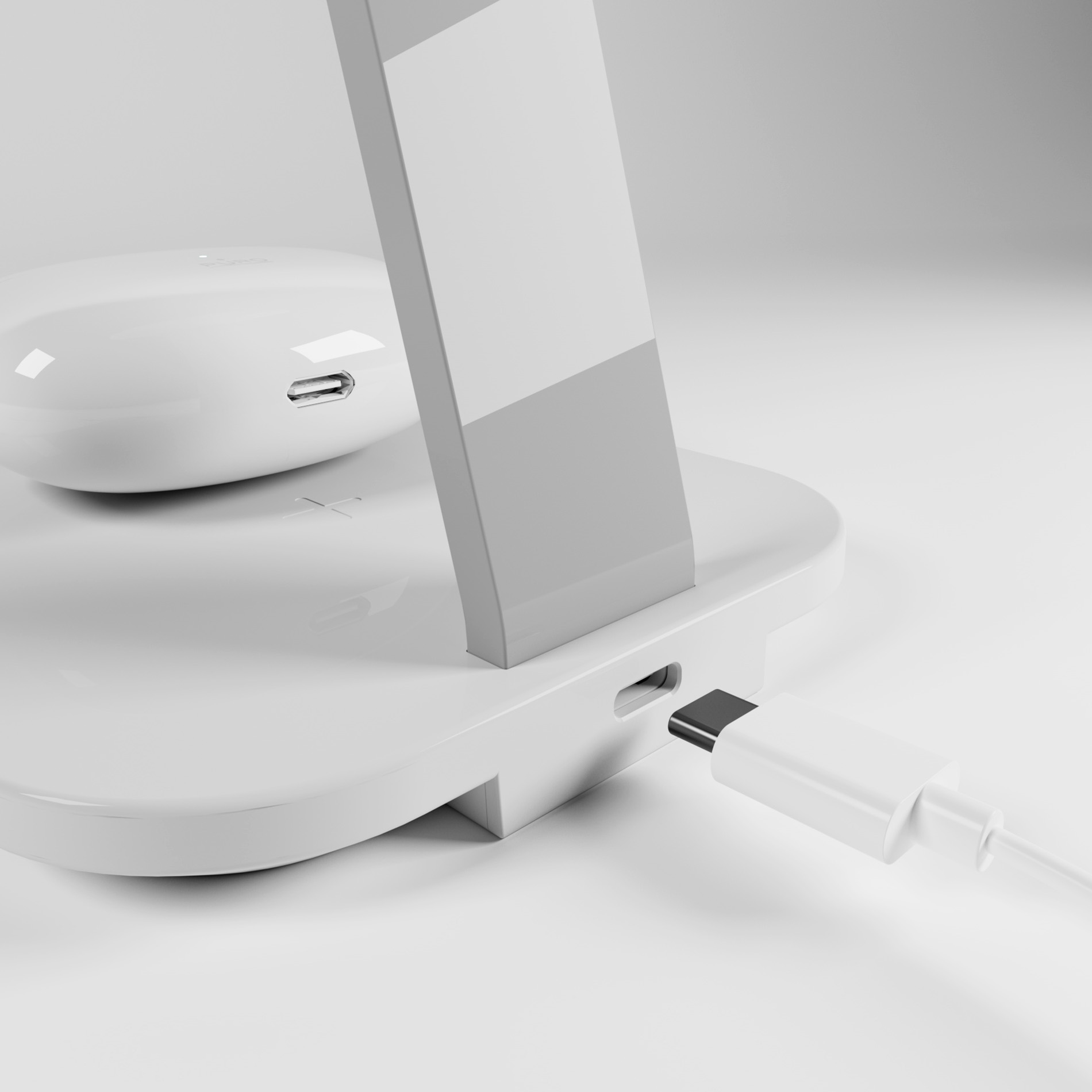 Un supporto di ricarica bianco con un cavo USB-C collegato e auricolari wireless sulla base su sfondo grigio.